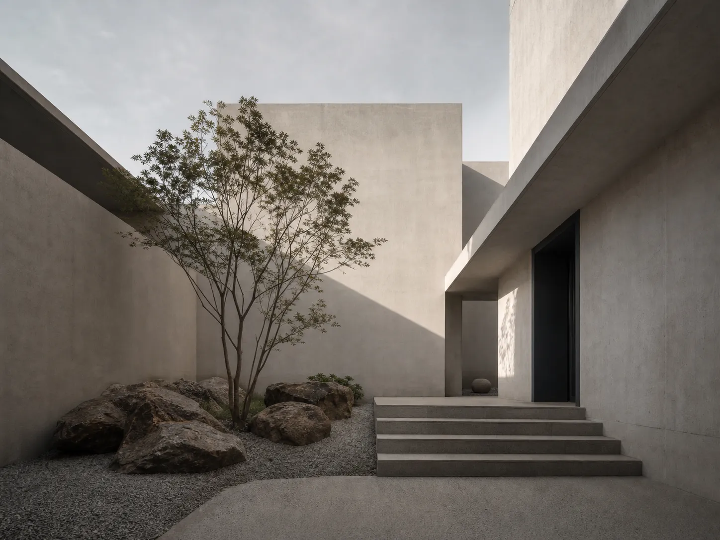 Liminal House courtyard with concrete walls and tree