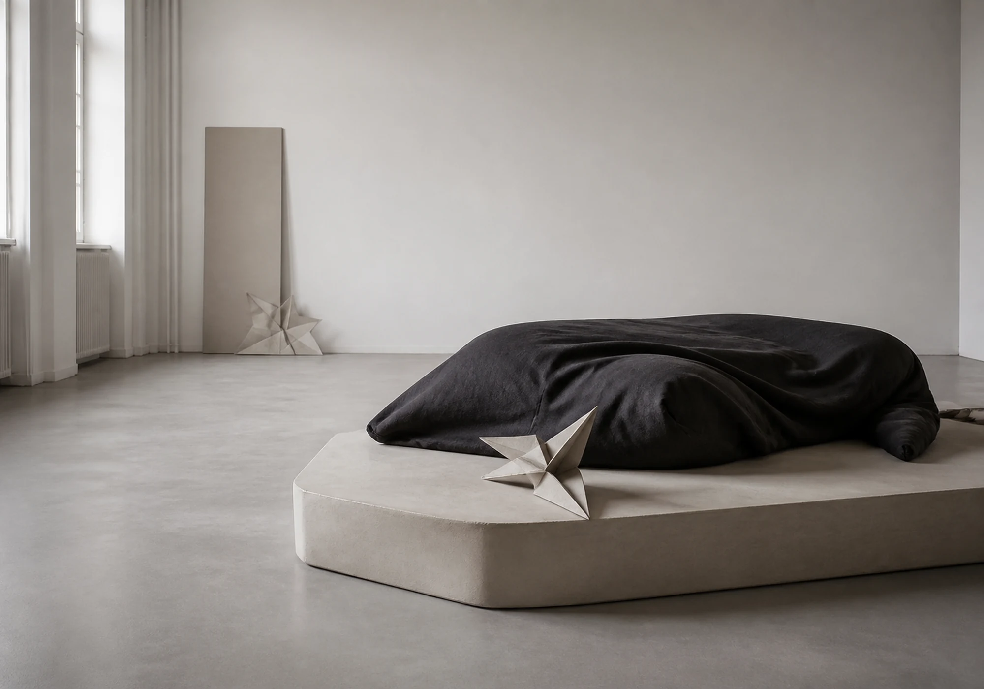 minimal gallery installation with black fabric object