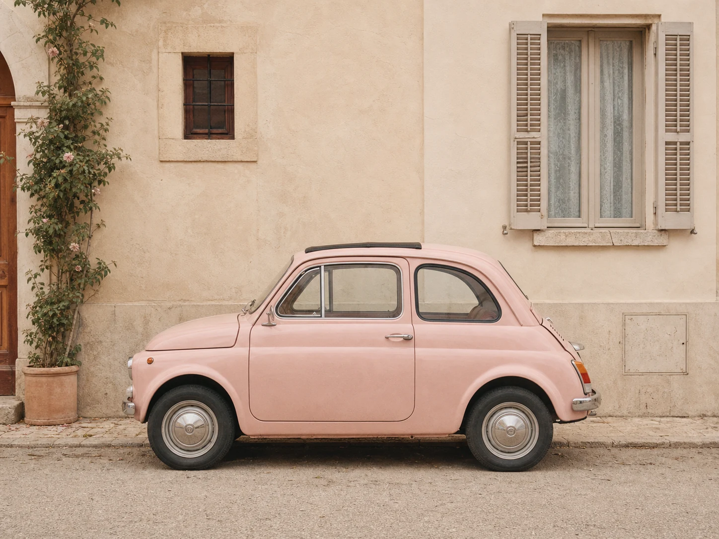 Small pale pink classic car