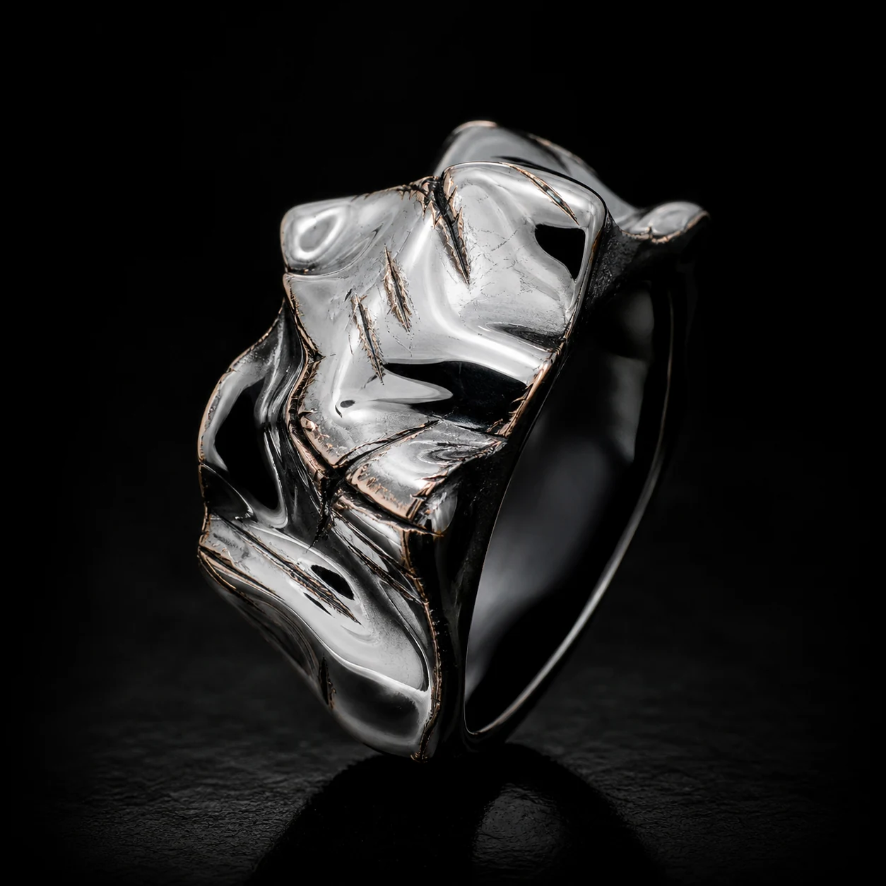 Chrome Scar Ring with engraved scar-like cuts.