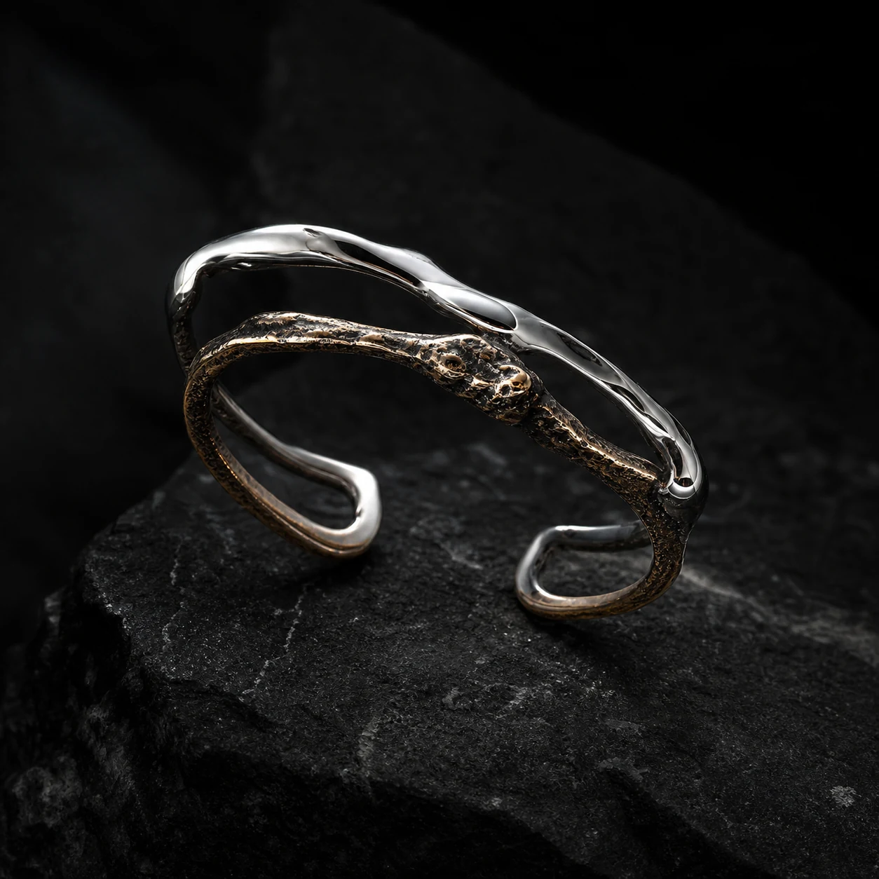 Orbit Ear Cuff in mirror silver and oxidized bronze.