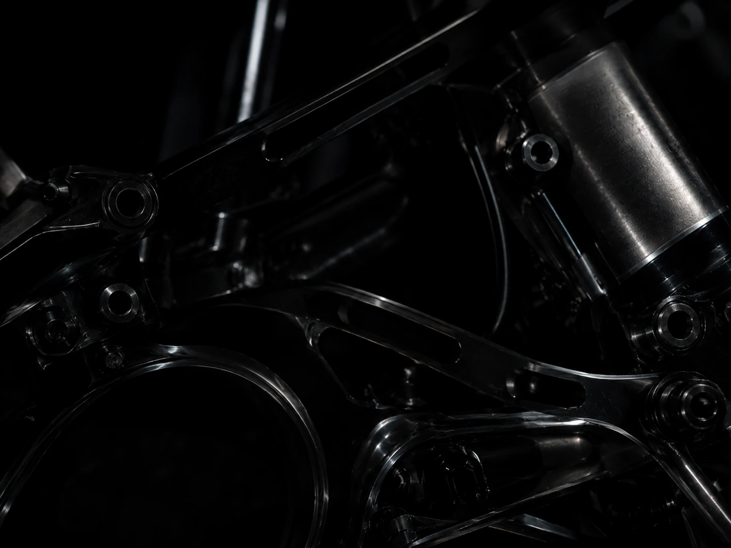 Foreground black mechanical hub and bolt assembly