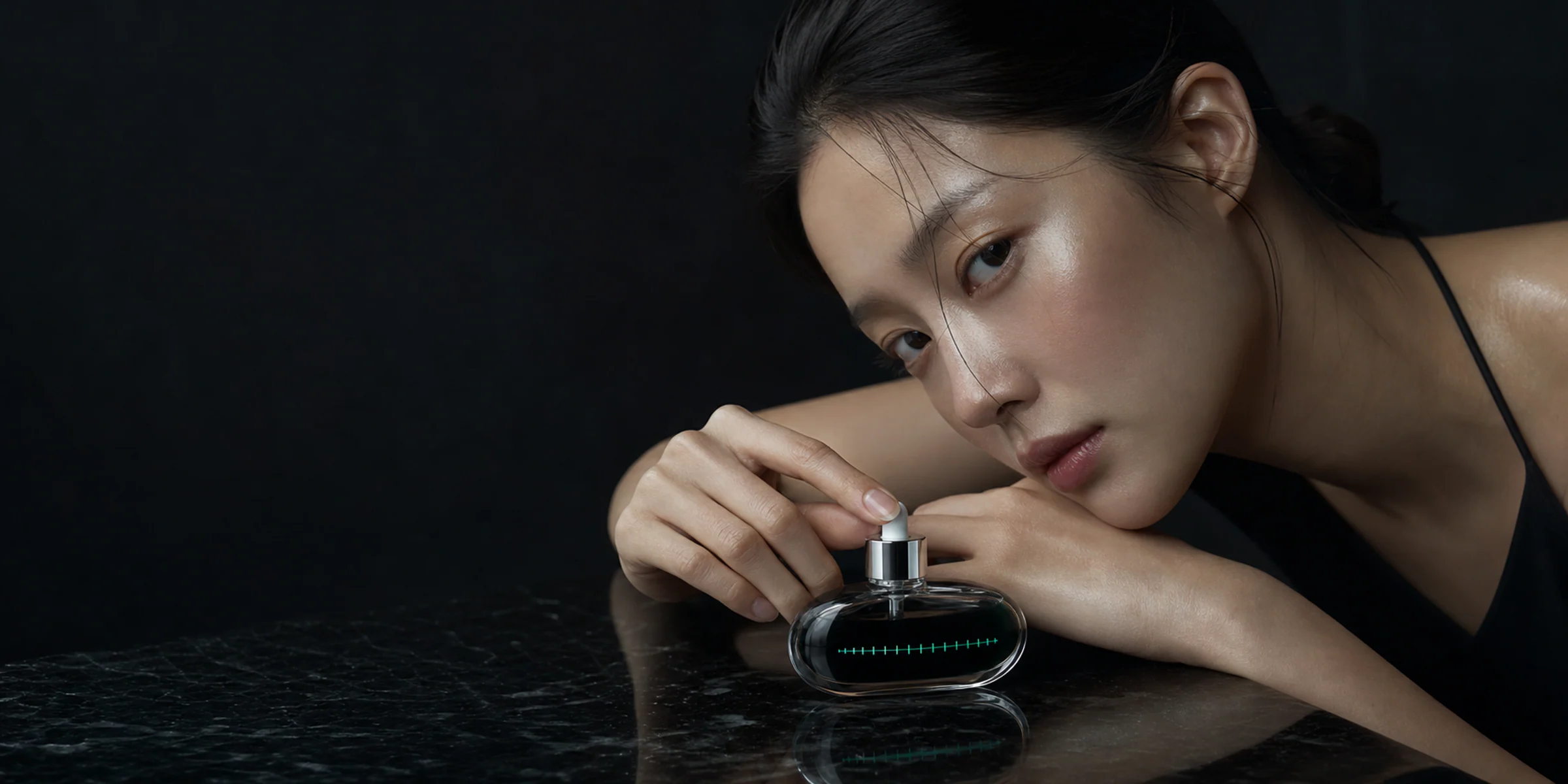 SEREVA black facial oil bottle in cinematic silver light