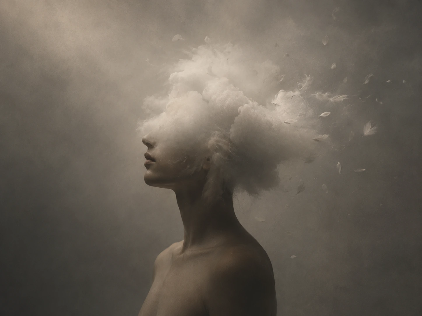 A human profile dissolving into pale dust and cloud.